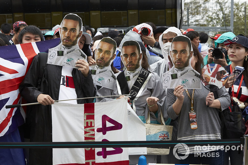 Fans with masks of Lewis Hamilton, Mercedes AMG F1