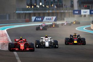 Kimi Raikkonen, Ferrari SF71H, Charles Leclerc, Sauber C37, and Daniel Ricciardo, Red Bull Racing RB14, battle at the start of the race