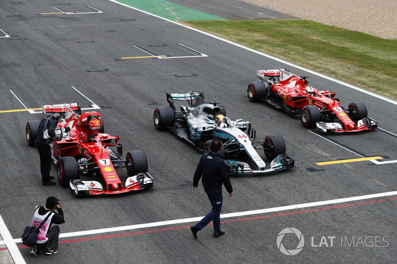 The top-three line-up from qualifying stop on the start-finish straight. Pole winner Lewis Hamilton, Mercedes AMG F1, parks between Kimi Raikkonen, Ferrari and Sebastian Vettel, Ferrari