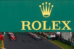 Lewis Hamilton, Mercedes AMG F1 W08, and Sebastian Vettel, Ferrari SF70H, prepare to lead the field away for the start