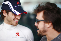 Antonio Giovinazzi, Sauber, and Fernando Alonso, McLaren