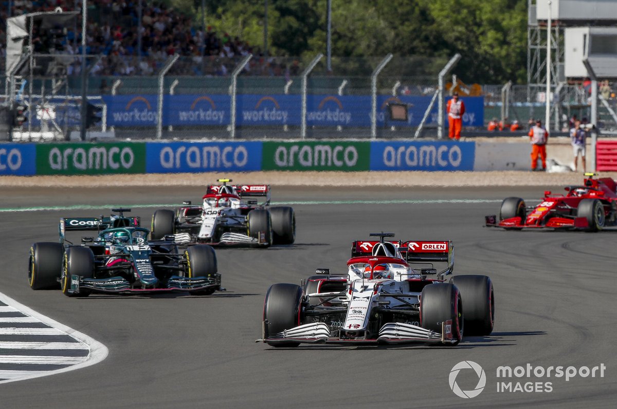 Kimi Raikkonen, Alfa Romeo Racing C41 , leadsLance Stroll, Aston Martin AMR21, and Antonio Giovinazzi, Alfa Romeo Racing C41, and Carlos Sainz Jr., Ferrari SF21
