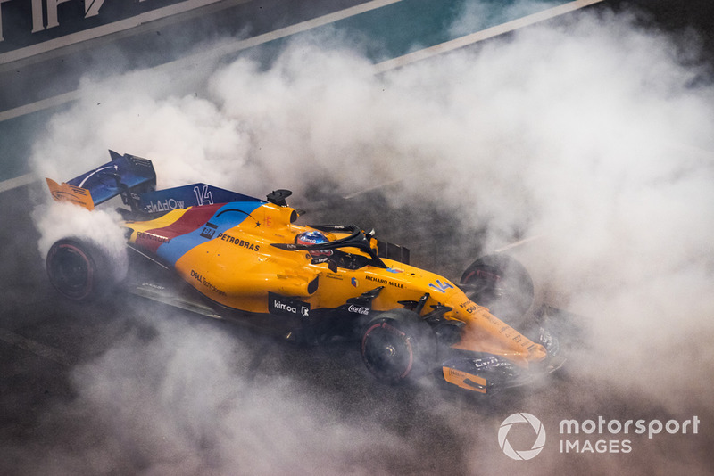 Fernando Alonso, McLaren MCL33, performs donuts on the grid at the end of the race