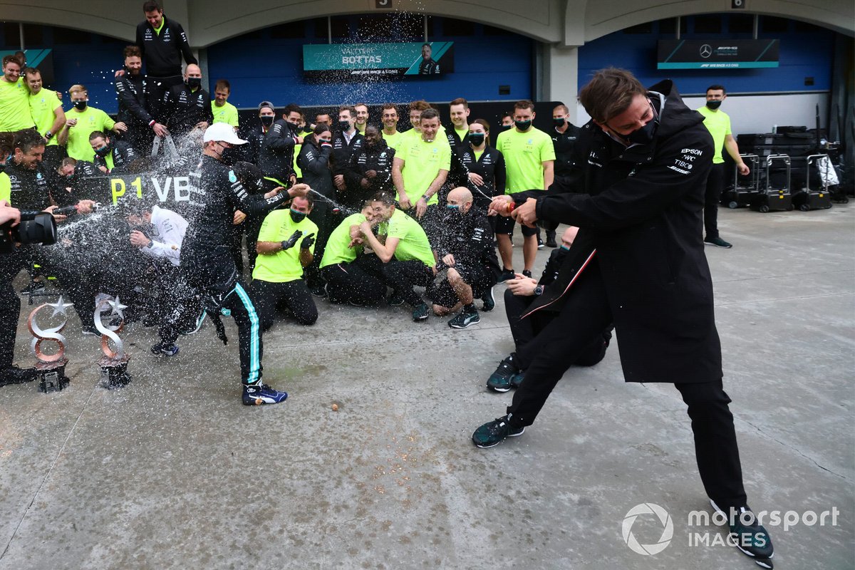 Toto Wolff, Team Principal and CEO, Mercedes AMG, sprays Champagne at Valtteri Bottas, Mercedes, 1st position, and the Mercedes team