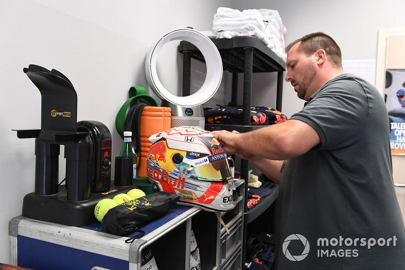A Schuberth helmet engineer works on the helmet of Max Verstappen, Red Bull Racing