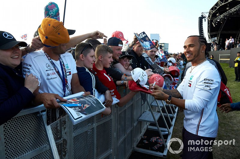 Lewis Hamilton, Mercedes AMG F1, signs autographs for fans