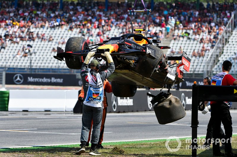 Marshals deal with the damaged car of Pierre Gasly, Red Bull Racing RB15