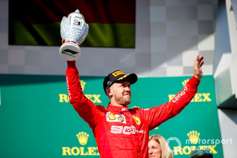 Sebastian Vettel, Ferrari, 3rd position, celebrates with his trophy