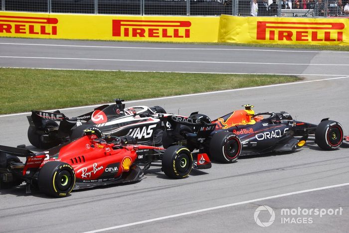 Sergio Pérez, Red Bull Racing RB19, Kevin Magnussen, Haas VF-23, Carlos Sainz, Ferrari SF-23