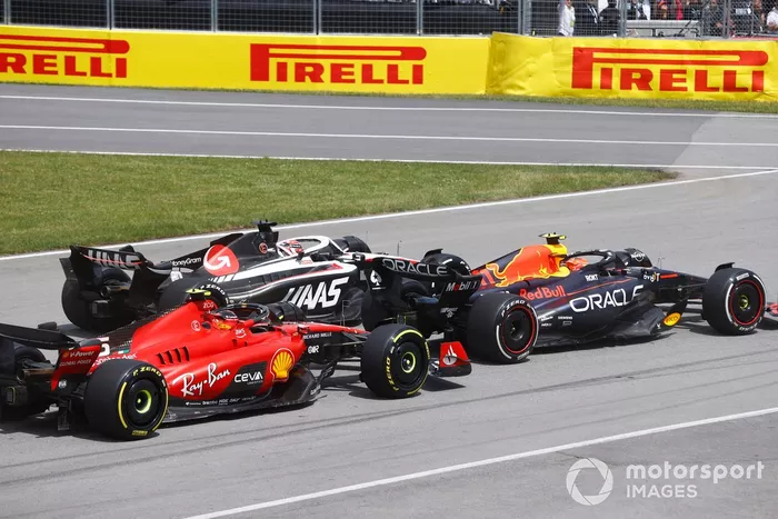 Sergio Pérez, Red Bull Racing RB19, Kevin Magnussen, Haas VF-23, Carlos Sainz, Ferrari SF-23