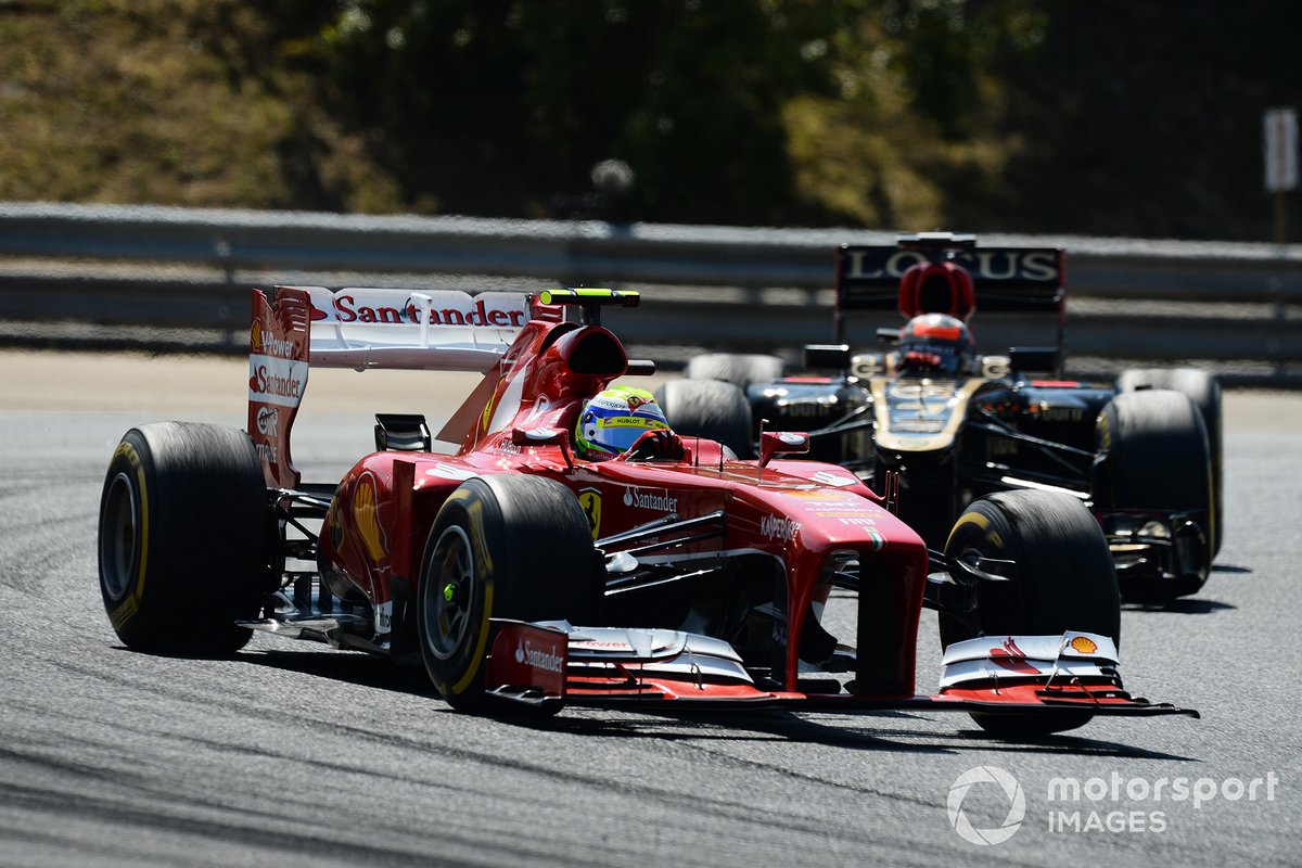 Felipe Massa, Ferrari F138 y Romain Grosjean, Lotus E21