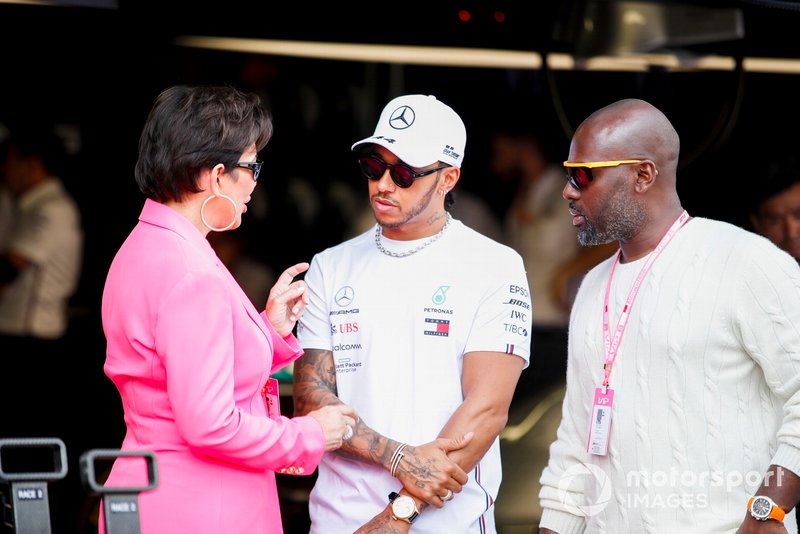 Kris Jenner and Corey Gamble talk with Lewis Hamilton, Mercedes AMG F1
