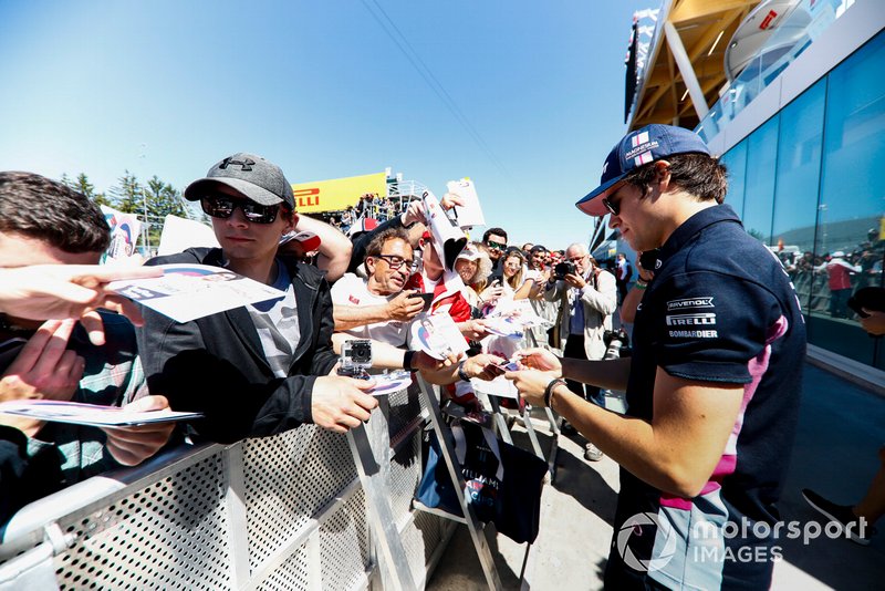 Lance Stroll, Racing Point signs a autograph for a fan