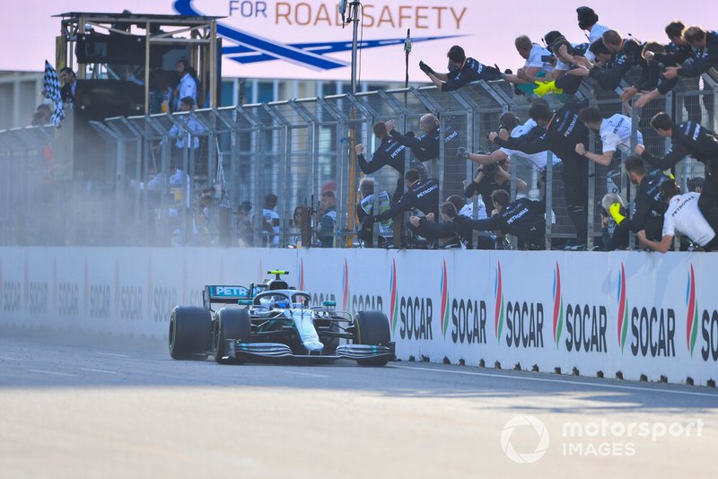 Valtteri Bottas, Mercedes AMG W10, 1st position, passes his team on the pit wall