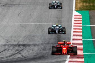 Charles Leclerc, Ferrari SF90, leads Valtteri Bottas, Mercedes AMG W10, and Lewis Hamilton, Mercedes AMG F1 W10