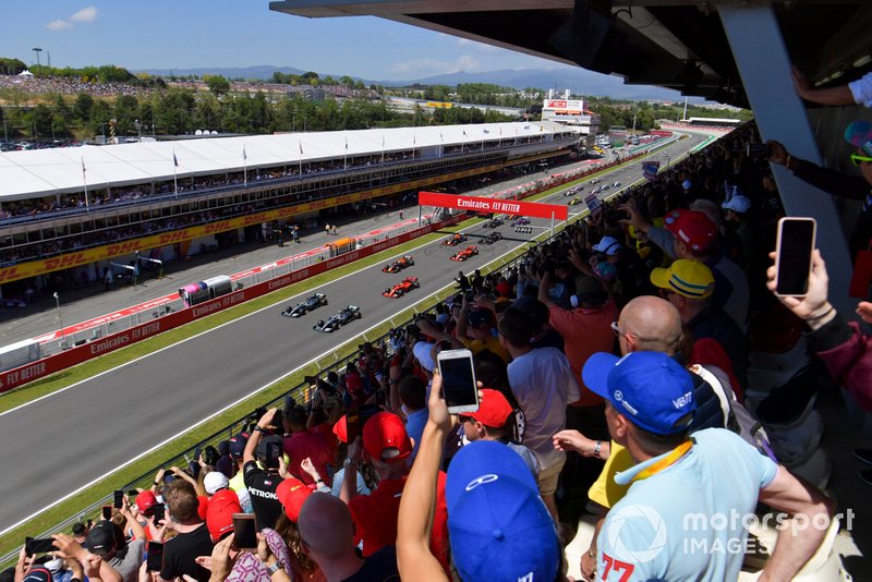 Valtteri Bottas, Mercedes AMG W10, and Lewis Hamilton, Mercedes AMG F1 W10, lead the field away at the start