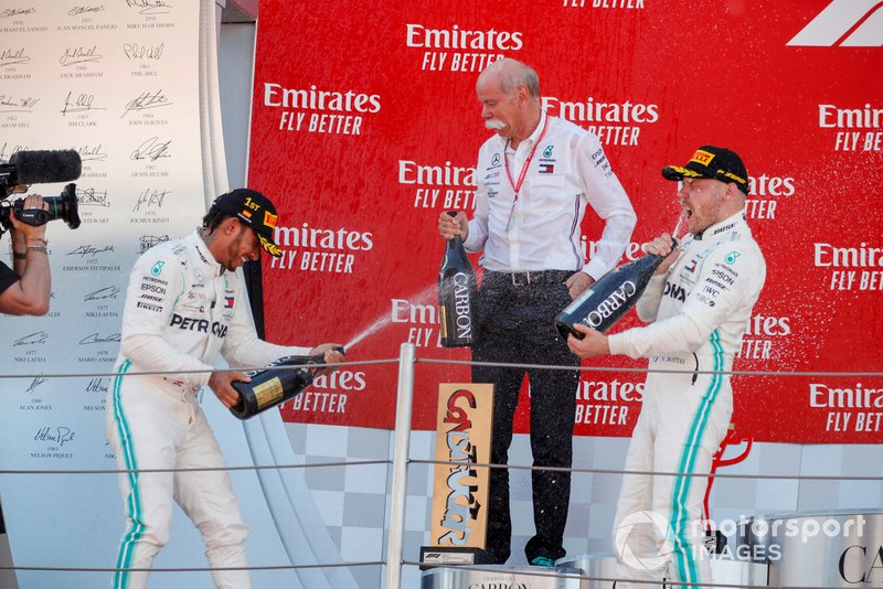 Race winner Lewis Hamilton, Mercedes AMG F1, Dr Dieter Zetsche, CEO, Mercedes Benz and Valtteri Bottas, Mercedes AMG F1 celebrate on the podium with the champagne