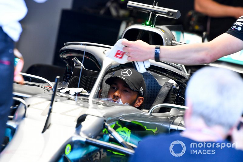 Lewis Hamilton, Mercedes AMG F1 W10 sits in the cockpit of his car in the garage