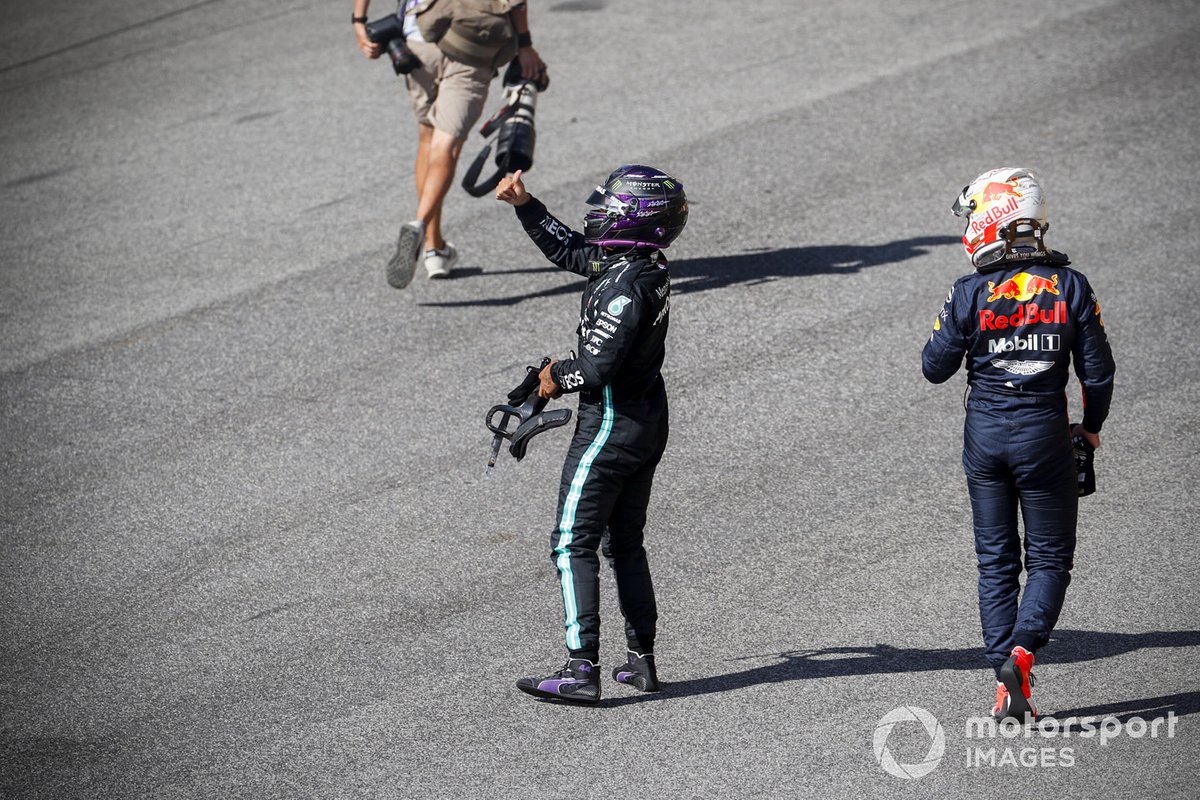 Lewis Hamilton, Mercedes-AMG F1, celebrates on the grid after securing pole alongside Max Verstappen, Red Bull Racing