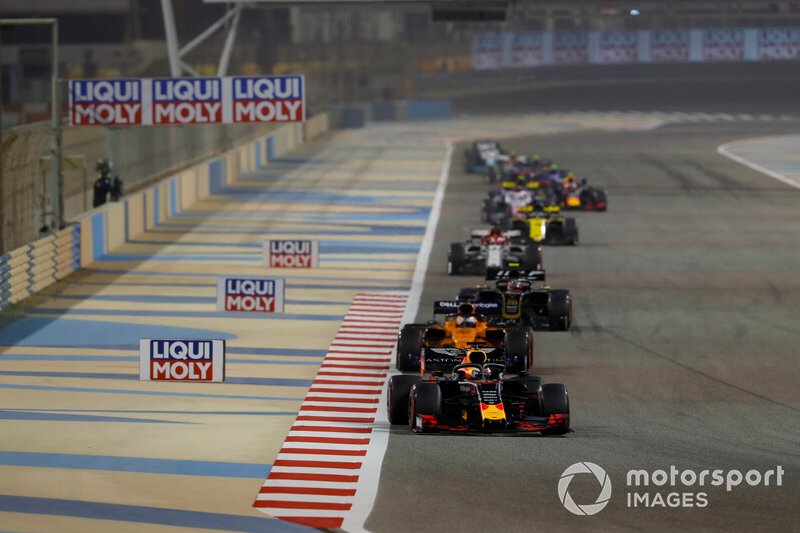Max Verstappen, Red Bull Racing RB15, leads Carlos Sainz Jr., McLaren MCL34, Kevin Magnussen, Haas F1 Team VF-19, and Kimi Raikkonen, Alfa Romeo Racing C38
