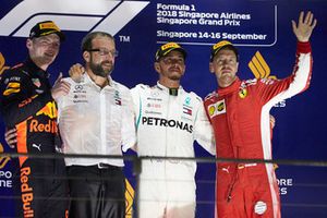 Max Verstappen, Red Bull Racing, 2nd position, the Mercedes Constructors Trophy delegate, Lewis Hamilton, Mercedes AMG F1, 1st position, and Sebastian Vettel, Ferrari, 3rd position, on the podium