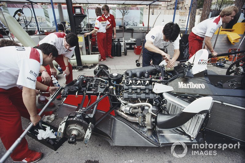 Mechanics work on the McLaren MP4-4 Honda of Alain Prost