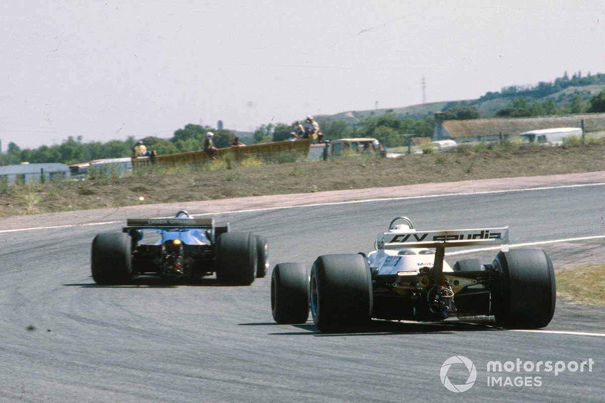 Alan Jones, Williams FW07B Ford, follows Didier Pironi, Ligier JS11/15 Ford