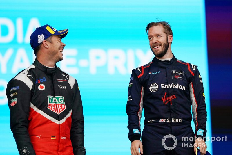 Andre Lotterer, Porsche, celebrates on the podium Sam Bird, Virgin Racing, on the podium