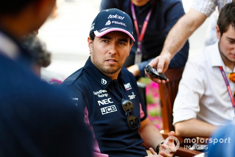 Sergio Perez, Racing Point, talks to the media