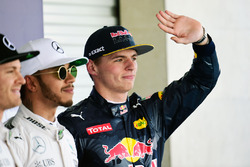 Qualifying top three in parc ferme (L to R): Nico Rosberg, Mercedes AMG F1, second; Lewis Hamilton,