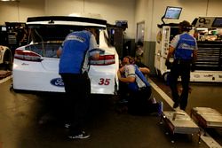 Mechanics working on the of David Gilliland, Front Row Motorsports Ford