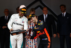 Lewis Hamilton, Mercedes AMG F1, fills the shoe of Daniel Ricciardo, Red Bull Racing with Champagne