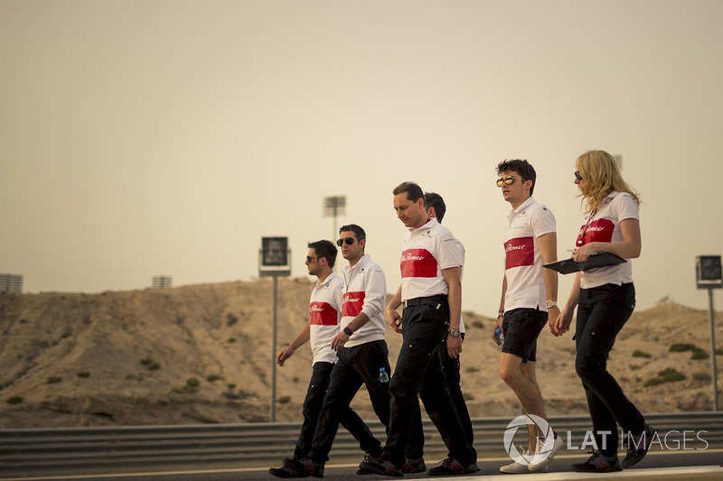 Charles Leclerc, Sauber and Ruth Buscombe, Sauber Race Strategist walk the track