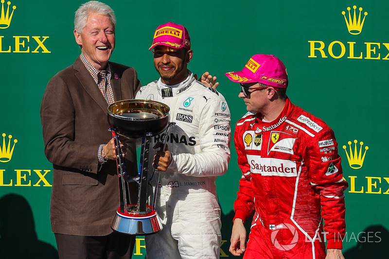 Race winner Lewis Hamilton, Mercedes AMG F1 celebrates on the podium with former US President Bill C