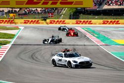 The safety car leads Lewis Hamilton, Mercedes AMG F1 W09, Sebastian Vettel, Ferrari SF71H and Valtteri Bottas, Mercedes AMG F1 W09