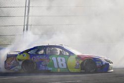 Kyle Busch, Joe Gibbs Racing, Toyota Camry M&M's Caramel celebrates with a burnout after winning 