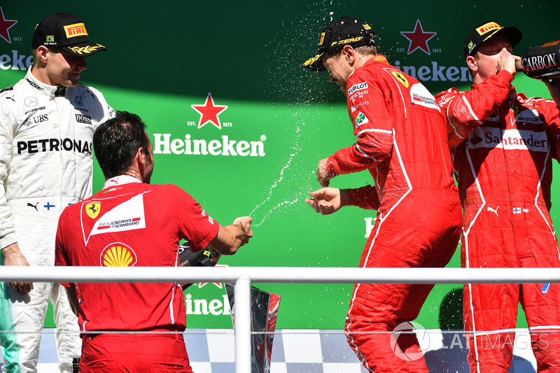 Podium: winner Sebastian Vettel, Ferrari, second place Valtteri Bottas, Mercedes AMG F1, third place Kimi Raikkonen, Ferrari