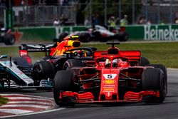 Sebastian Vettel, Ferrari SF71H, leads Valtteri Bottas, Mercedes AMG F1 W09, and Max Verstappen, Red