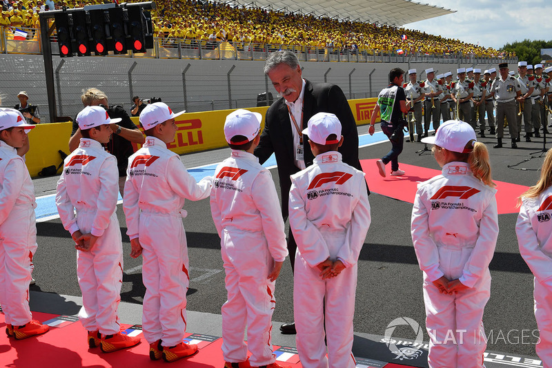 Chase Carey, Chief Executive Officer and Executive Chairman of the Formula One Group and grid kids