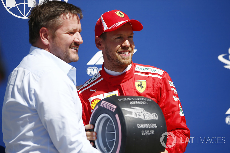 Paul Hembrey, Director, Pirelli Motorsport, presents Sebastian Vettel, Ferrari, with the Pirelli Pol