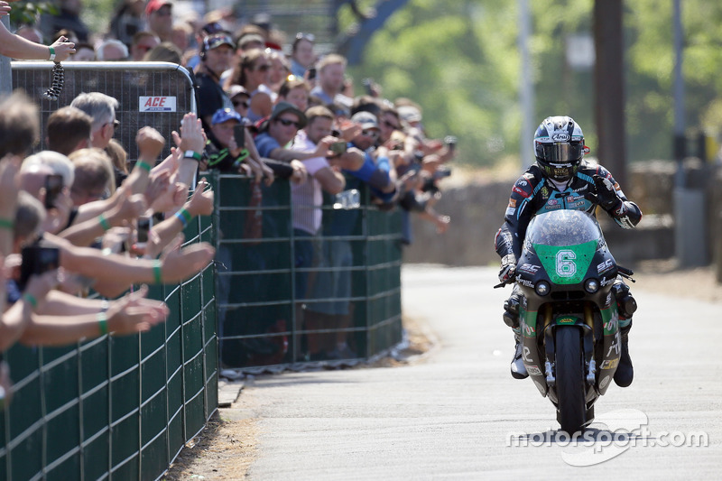 Michael Dunlop celebrates winning his third TT of the week in the Lightweight race