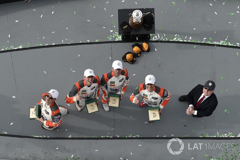 #54 CORE autosport ORECA LMP2, P: Jon Bennett, Colin Braun, Romain Dumas, Loic Duval celebrate in victory lane with Rolex watches