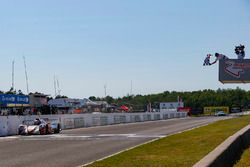 #54 CORE autosport ORECA LMP2, P: Jon Bennett, Colin Braun, Crosses the Start / Finish Line under the Checkered Flag