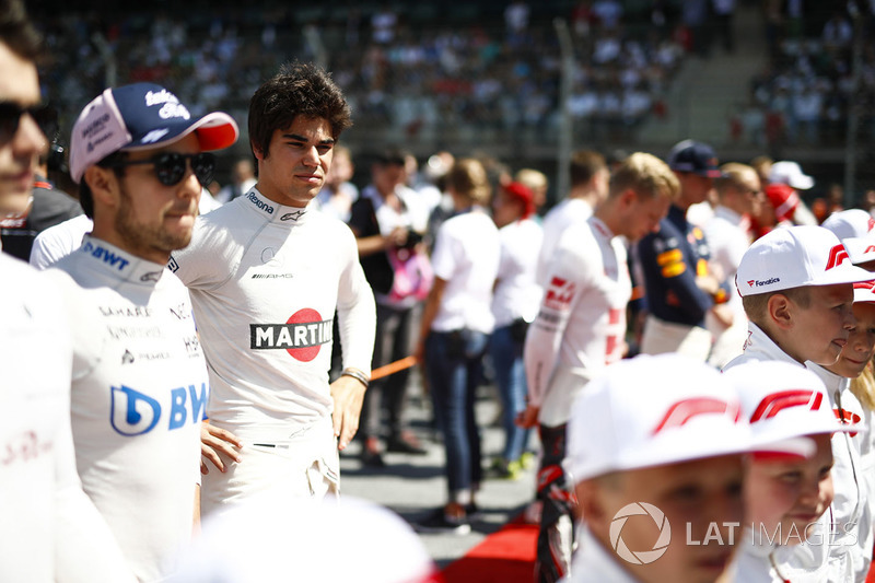 Sergio Perez, Force India, and Lance Stroll, Williams Racing, with Grid Kids