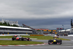 Sebastian Vettel, Red Bull Racing RB7 leads Jenson Button, McLaren MP4-26