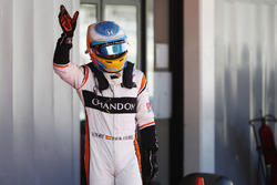 Fernando Alonso, McLaren, waves to his home fans after Qualifying