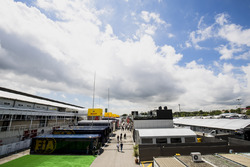 Motorhomes, trucks and hospitality units in a scenic view of the Barcelona paddock. The FIA motorhomes are in the foreground, along, the TV compound
