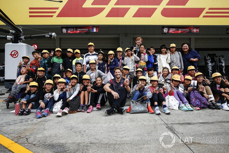 Romain Grosjean, Haas F1 Team, meets some fans in the pit lane