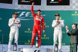 Sebastian Vettel, Ferrari, 1st Position, Lewis Hamilton, Mercedes AMG, 2nd Position, and Valtteri Bottas, Mercedes AMG, 3rd Position, celebrate on the podium