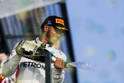 Lewis Hamilton, Mercedes AMG, 2nd Position, sprays Champagne from the podium
